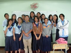 Photo of Arihiko Hasegawa with students at Mindanao International College