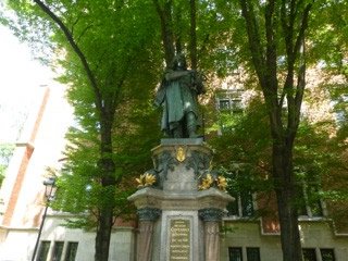 Picture of a statue of Copernicus that stands next to the main part of the University—Copernicus studied at Jagiellonian University.