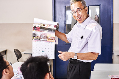 Photo of NIHONGO Partners giving a lesson to students in classroom