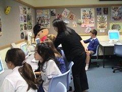 Photo of Kyoko Nagashima with students at the New South Wales (NSW) Department of Education and Training