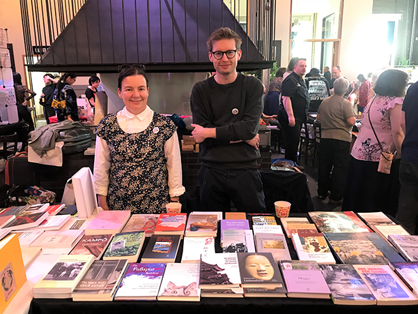 A man and a woman introducing a book