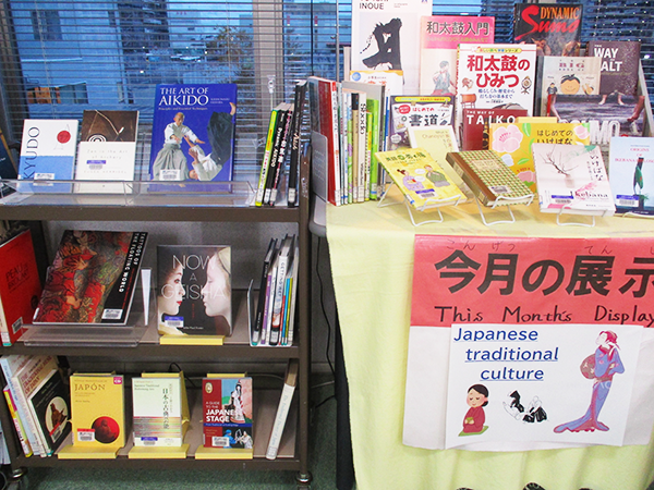 On the table and the bookshelf, there are numerous books about [Japanese traditional culture].