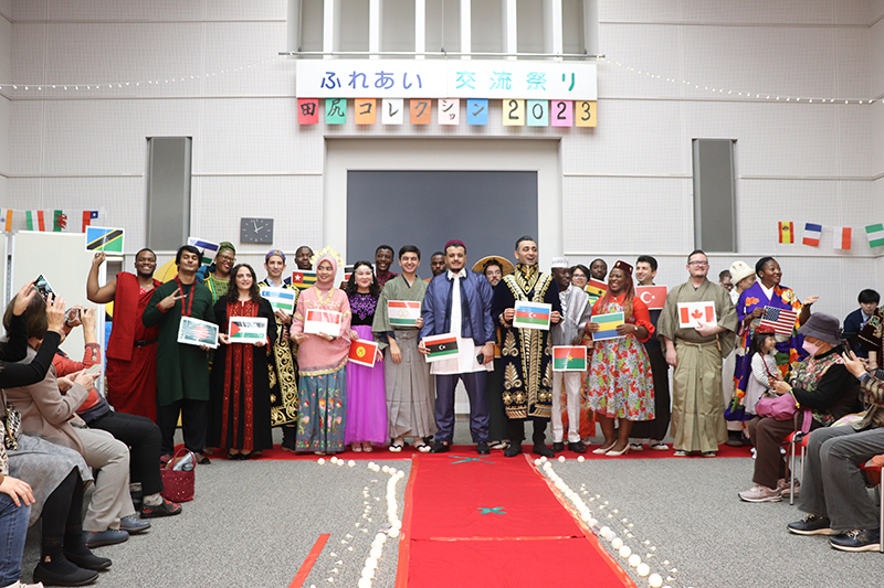 A scenes from the ’Tajiri Collection 2023’. The program participants are wearing traditional costumes.