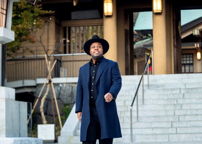 Photo of Chris, in front of a shrine #2