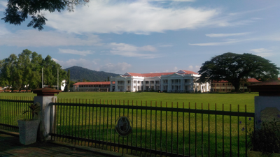 Photo of the school’s dormitory and sports field