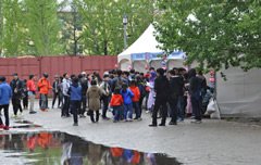 Picture of people milling around the booths