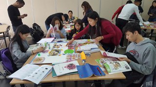 Picture of groups working on making their posters