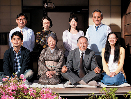 A scene in the movie Tokyo Family. Eight cast members are pictured.