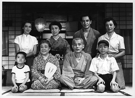 A scene in the movie Tokyo Family. Eight cast members are pictured.