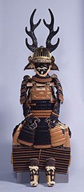 Photo of Suit of Armor with Dark Blue and Red Lacing