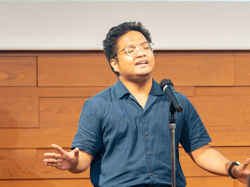 Photo of Paolo reciting a poem