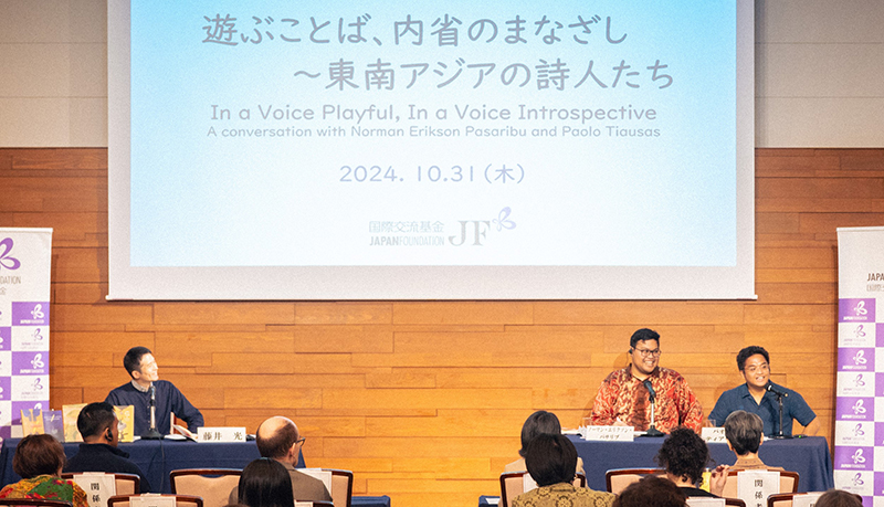 Photo of Mr. Fujii (left), Mr. Norman (middle), and Mr. Paolo (right) on stage